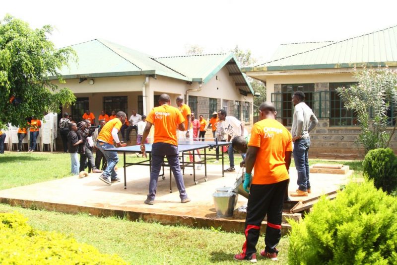 GSK team playing table tennis with the children from Amref Child Protection and Development Centre Dagoretti