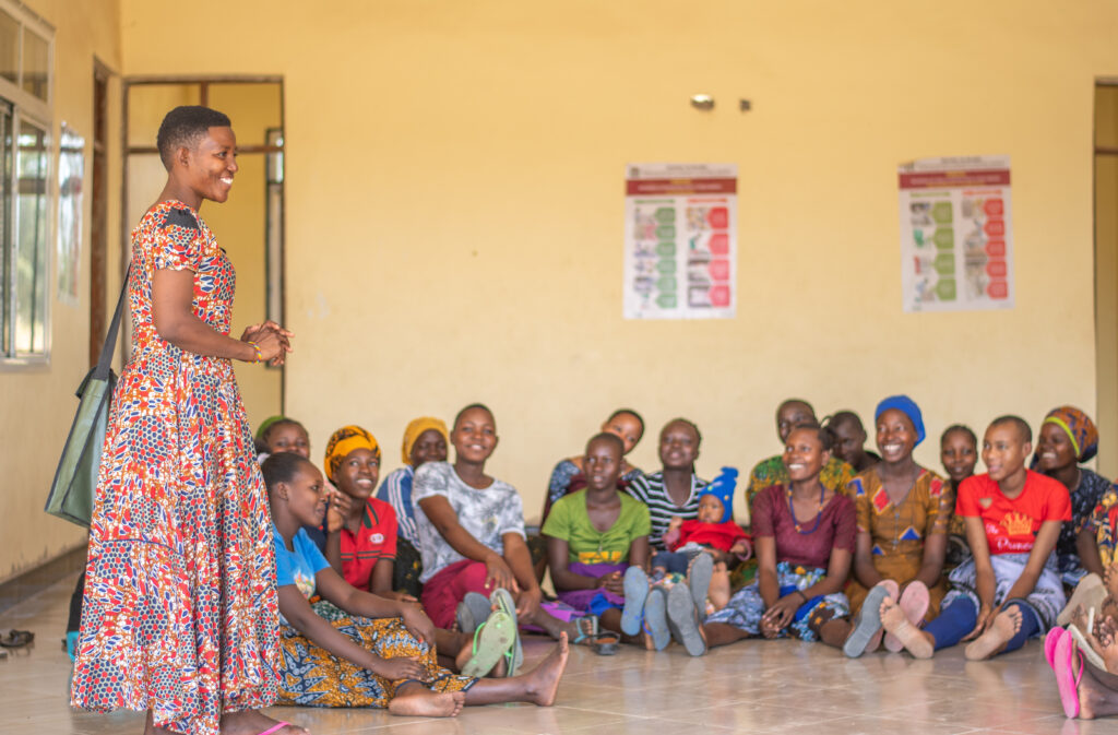 
Veronica Kalani, out-of-school AGYW peer educator in Bahi District, Dodoma region in a peer sessions with fellow young mothers AGYW. © For Amref Health Africa Tanzania.
